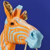 Werner Vob WERNS® Zebra Zora wall lamp in blue and orange, featuring a stylish zebra design for modern indoor lighting.