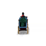 Lemax Christmas Village table accent featuring festive holiday scene with detailed buildings and winter decorations.