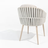 4 Seasons Outdoor Eva 6-seat metal dining set with Manolo 180cm barrel ceramic table and latte-colored dining chairs with cushions.