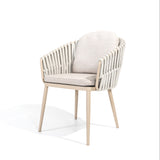 4 Seasons Outdoor Eva 6-seat metal dining set with Manolo 180cm barrel ceramic table and latte-colored dining chairs with cushions.