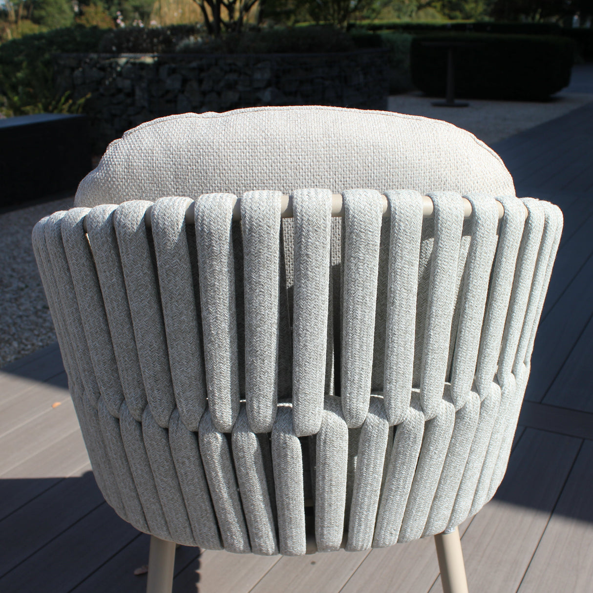 4 Seasons Outdoor Eva 6-seat metal dining set with Manolo 180cm ceramic table, latte-colored chairs and cushions, outdoor furniture