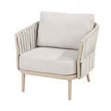 4 Seasons Outdoor Eva lounge set with two Monroe coffee tables in latte metal, featuring a chair with cushions and gentle support table.