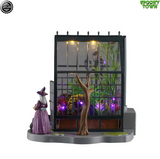 Lemax Spooky Town Agatha's Greenhouse tabletop accent with detailed spooky greenhouse and figure display in a miniature scene.