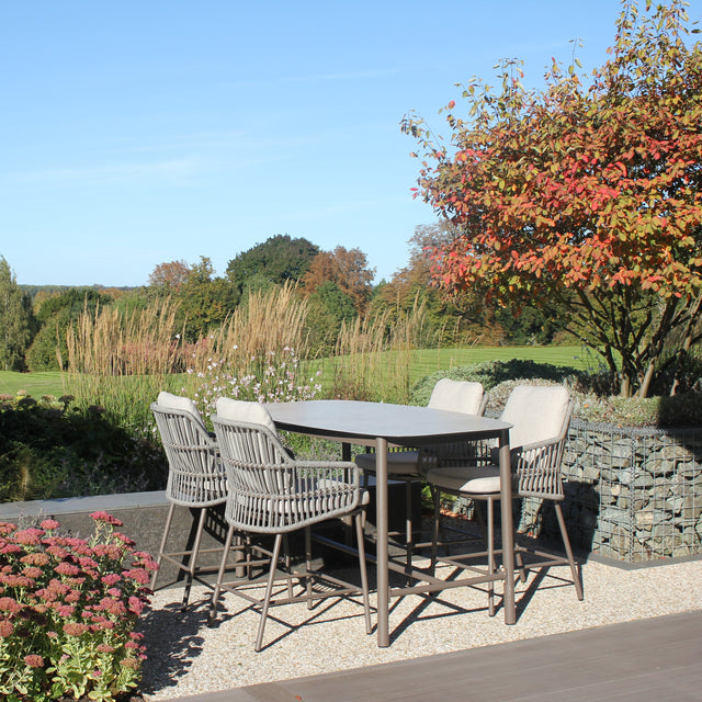 4 Seasons Outdoor Alicante 4-seat metal dining set with Manolo 180cm high ceramic table, featuring sleek design and sturdy construction.