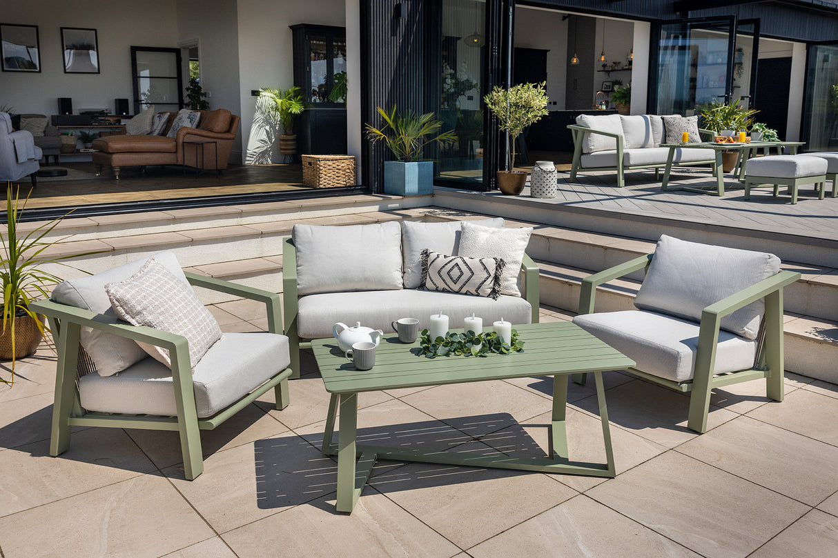 Hartman Alora 2-seat lounge set in sage aluminum with cushioned seats and a matching table, outdoor garden furniture.