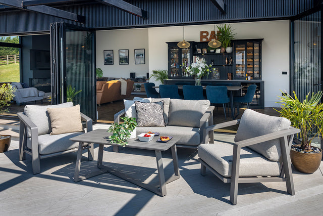Hartman Alora two-seat lounge set in taupe with metal frame, featuring cushioned seats and a modern outdoor furniture design.