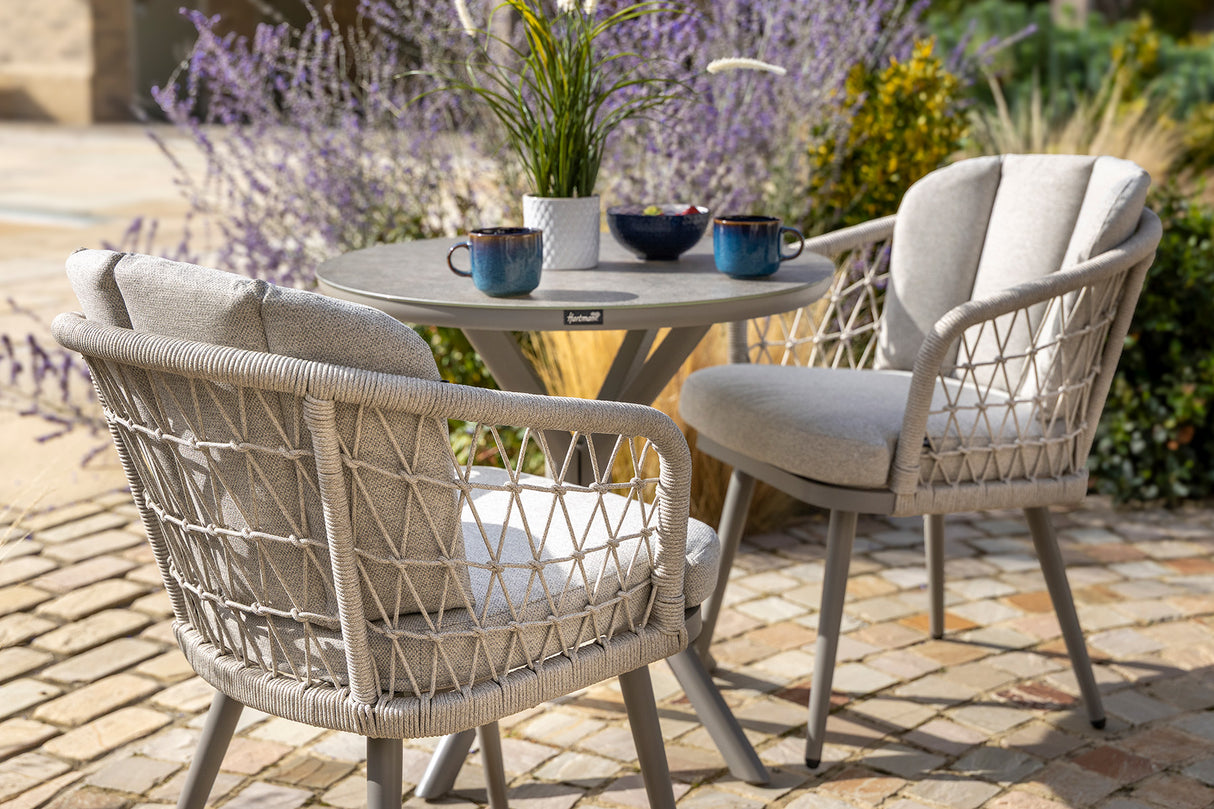 Hartman Aries Bistro Set with metal table and chairs, outdoor furniture for patio dining and relaxing.