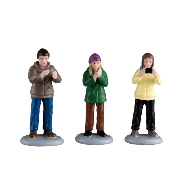 Lemax Christmas village audience figurine set with three detailed festive characters for holiday display decor.