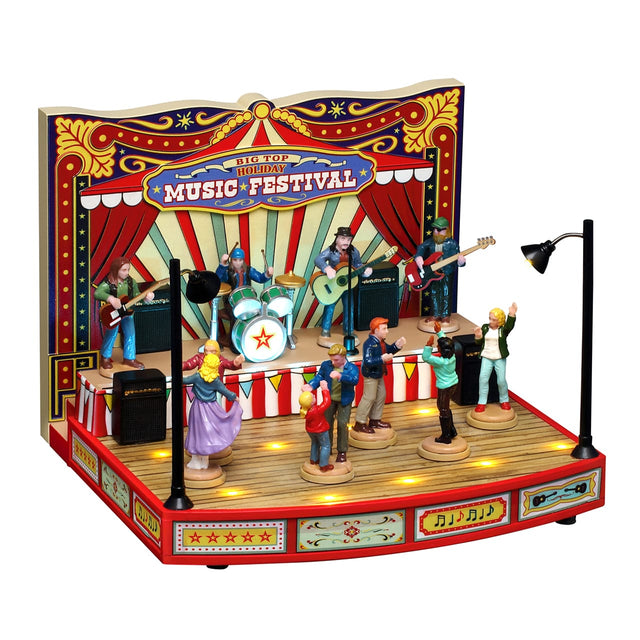 Lemax Sights & Sounds Big Top Holiday Music Festival display with festive decorations and a stage, illuminated for Christmas village scene