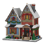 Lemax Carol Residence illuminated building from the Lemax Christmas Village collection, featuring festive holiday decorations and lights.