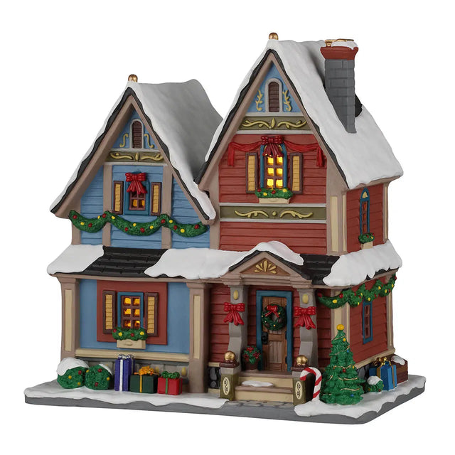 Lemax Carol Residence illuminated building from the Lemax Christmas Village collection, featuring festive holiday decorations and lights.