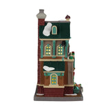 Lemax illuminated building Cathy’s Cushion Corner from the Christmas Village series, featuring a cozy corner shop with festive lights.