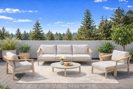 4 Seasons Outdoor Olivia lounge set with metal sofa, Vic coffee table, and footstool in a modern outdoor furniture scene.