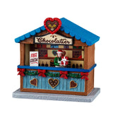Lemax Chocolatier Christmas Village table accent featuring a detailed chocolate shop scene with festive holiday decorations.