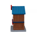 Lemax Chocolatier Christmas village table accent featuring a detailed chocolate shop scene with festive holiday decor.