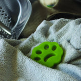 Creative Products Fuzz Buster pet hair and lint remover showing handheld tool with sticky surface for lint removal on clothing
