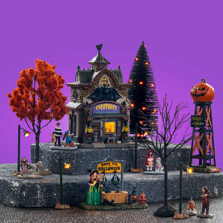 Lemax Spooky Town Creatures of the Night Pet Shop set with illuminated haunted pet shop building and spooky animal displays.