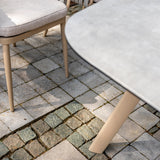 4 Seasons Outdoor Eva 6-seat metal dining set with Manolo 180cm ceramic barrel table and matching dining chairs.