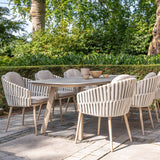 4 Seasons Outdoor Eva 6-seat metal dining set with Manolo 180cm barrel ceramic table and latte-colored dining chairs.
