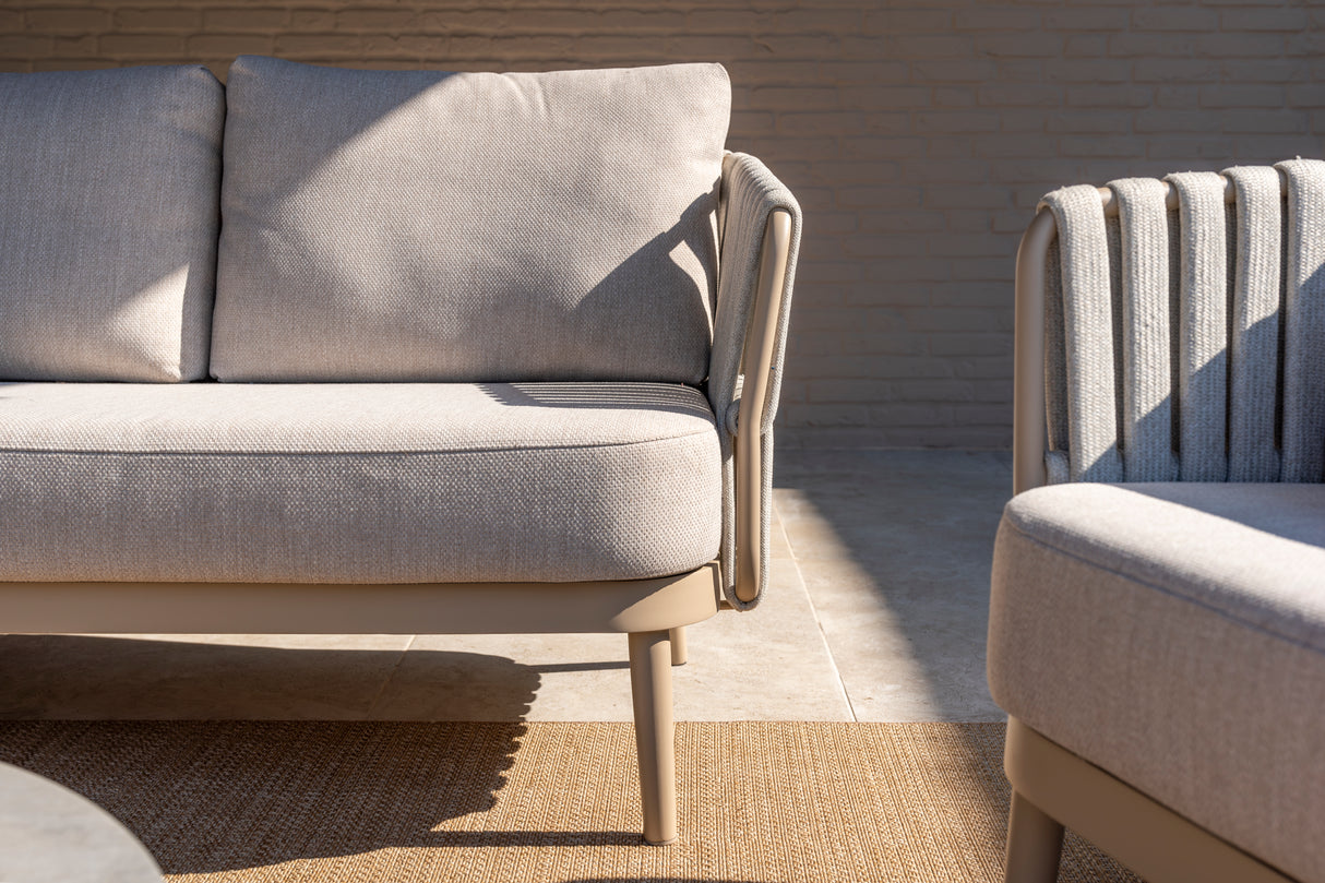 4 Seasons Outdoor Eva lounge set with matching Monroe coffee tables and support table, featuring metal frames and comfortable cushions.