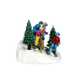 Lemax Family Ski Day Christmas table accent featuring a snowy family enjoying skiing scene with festive holiday details.
