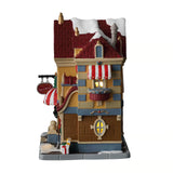 Lemax Father Christmas gift shop illuminated building from Christmas village collection with festive holiday lights and detailed decorations