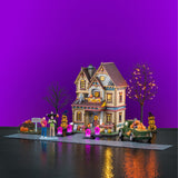 Lemax Spooky Town Halloween at the Wilsons illuminated building set featuring spooky house and Halloween decorations.