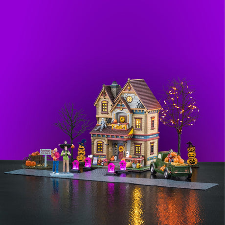 Lemax Spooky Town Halloween at the Wilsons illuminated building set featuring spooky house and Halloween decorations.