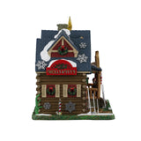 Lemax illuminated Christmas village building with Holly & Ivy's festive yard decor and intricate holiday details.