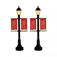 Set of two Lemax Christmas village lamp post banners with festive designs, perfect as Lemax accessories for holiday displays.