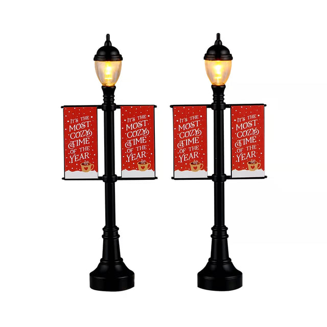 Set of two Lemax Christmas village lamp post banners with festive designs, perfect as Lemax accessories for holiday displays.