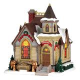 Lemax Maple Lane Chapel illuminated Christmas village building with detailed architecture and festive lighting display.