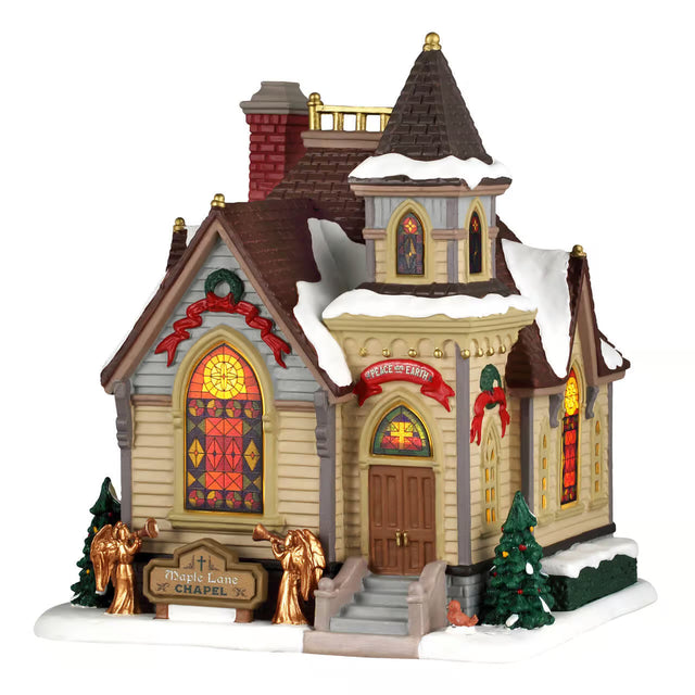Lemax Maple Lane Chapel illuminated Christmas village building with detailed architecture and festive lighting display.