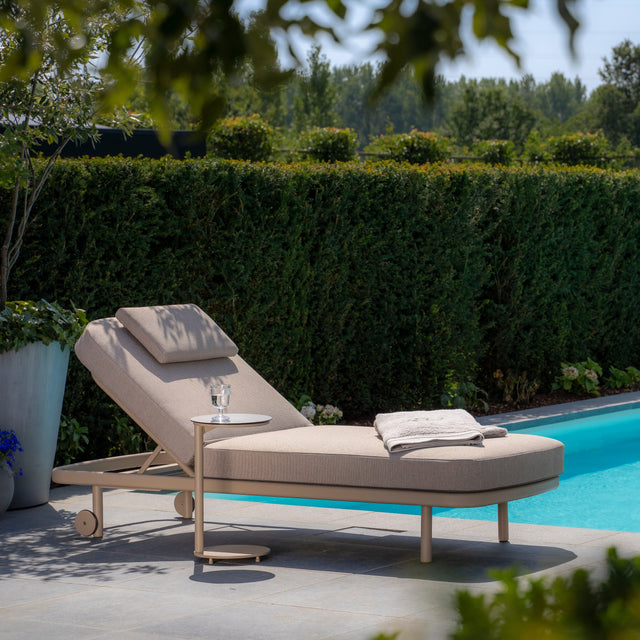 4 Seasons Outdoor Milano Sunbed in latte with cushion and headrest, metal frame, outdoor furniture for relaxing in style.