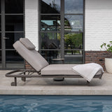 4 Seasons Outdoor Milano Terre sunbed in latte with cushion and headrest, metal outdoor furniture for relaxing outdoor lounging.