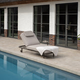 4 Seasons Outdoor Milano Terre sunbed in latte with cushion and headrest, metal outdoor furniture for relaxing outdoor lounging.