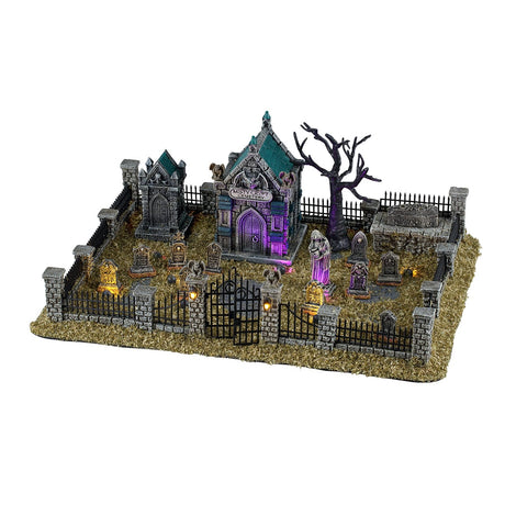 Lemax Spooky Town Misty Crypt Graveyard set of 15 illuminated buildings with 4.5V 100mA adaptor, featuring spooky graveyard scenes.