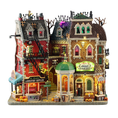 Lemax Spooky Town illuminated building featuring monsters on Main Street with spooky decorations, powered by 4.5V batteries.