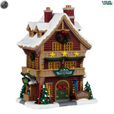Lemax Mountain View Hotel illuminated building from Christmas village display, detailed miniature hotel with festive lighting.