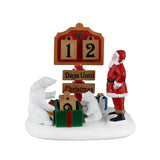 Lemax North Pole Countdown Christmas Village table accent featuring festive North Pole scene with miniature buildings and winter decorations.
