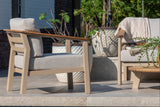 4 Seasons Outdoor Olivia lounge set with Vic coffee table and footstool, featuring metal frame and comfortable cushions.