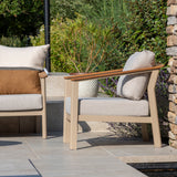 4 Seasons Outdoor Olivia lounge set with Vic coffee table and footstool, featuring metal frame and outdoor cushioned seating.