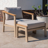 4 Seasons Outdoor Olivia lounge set with Vic coffee table and footstool, featuring elegant metal outdoor furniture with cushions.