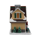 Lemax Penelope's Pies Christmas Village illuminated building with detailed bakery scene and festive holiday decorations.