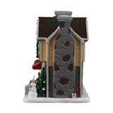 Lemax Penelope's Pies Christmas Village illuminated building with festive holiday storefront and detailed winter scene.