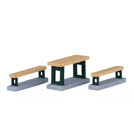 Set of three Lemax picnic benches for Christmas village accessories, featuring rustic wooden design and festive holiday details.