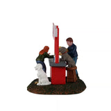Lemax Puppy Kissing Booth Christmas Village table accent featuring a cute puppy and festive holiday scene.