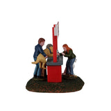 Lemax Puppy Kissing Booth Christmas Village table accent featuring a cute puppy at a festive kissing booth scene