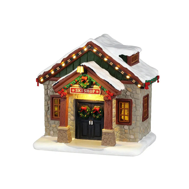 Lemax Ski Shop Christmas Village table accent featuring a festive ski shop scene with holiday decorations and miniature figures.