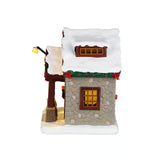 Lemax Ski Shop Christmas Village table accent featuring a festive ski shop scene with holiday decorations and snow details.